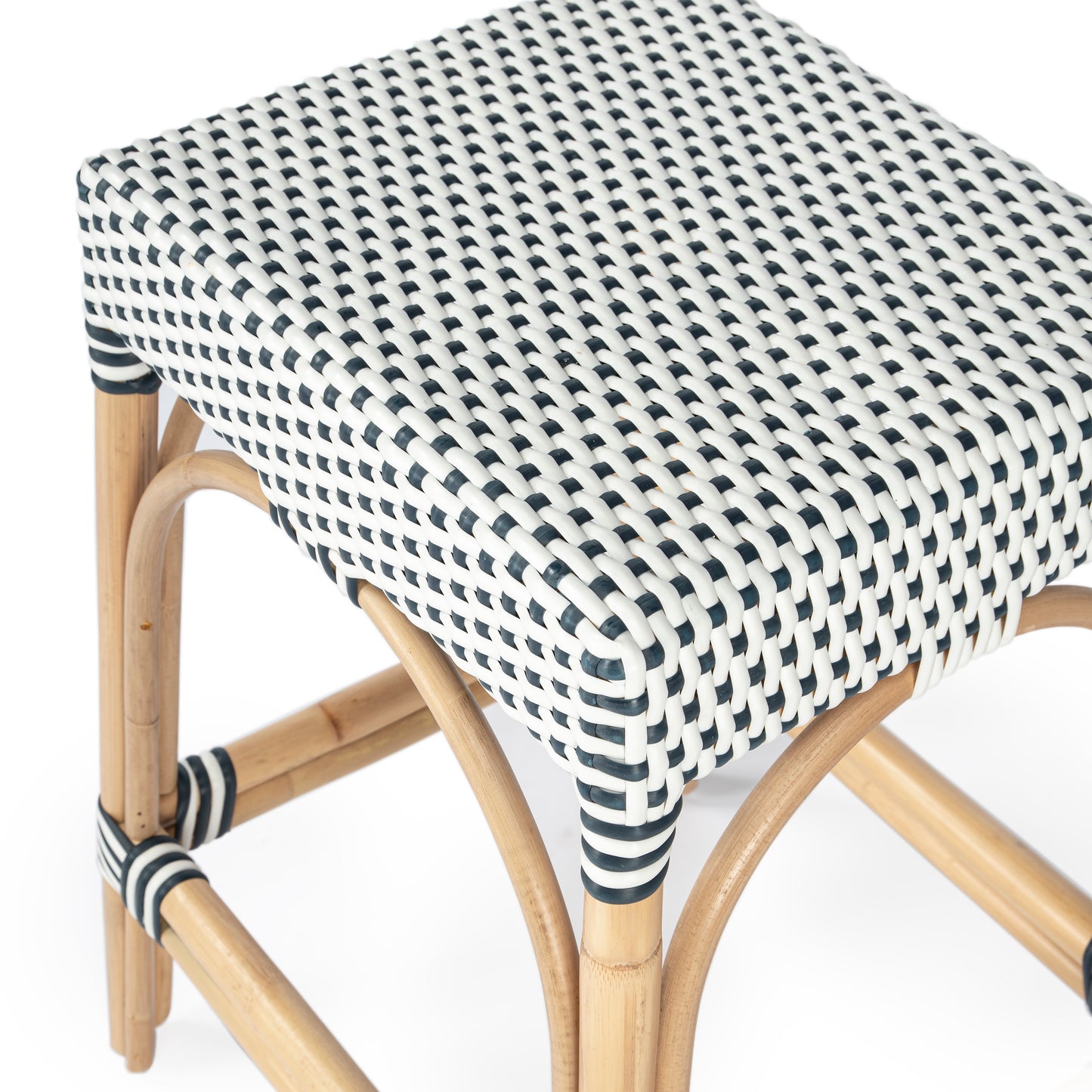 Butler Specialty Company Robias 24.5 in. Seat Height Rectangular Rattan Backless Counter Stool with Footrest, White and Navy Dot