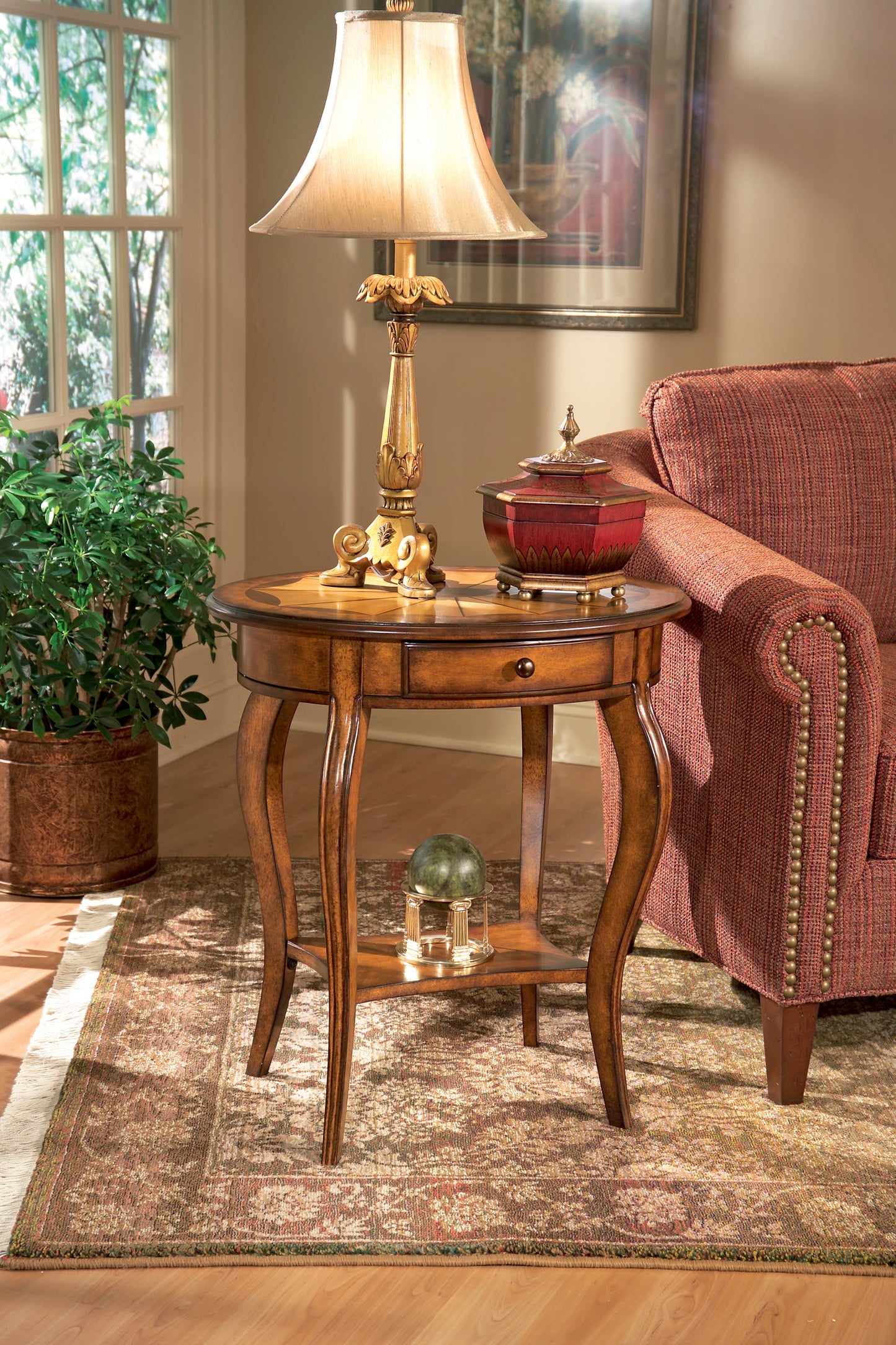 Butler Specialty Company Jeanette 24.5 in. W Oval Wood 1 Drawer Side Table with Lower Open Shelf, Medium Brown