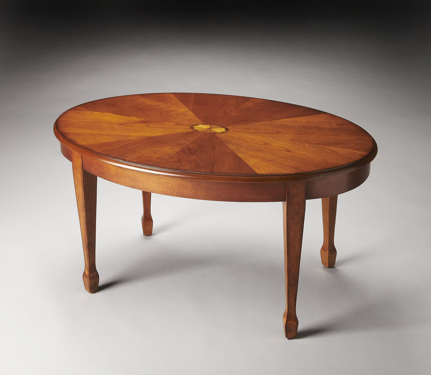Butler Specialty Company Clayton 38 in. W Oval Wood Coffee Table with Veneer Linen-Fold Inlay, Medium Brown