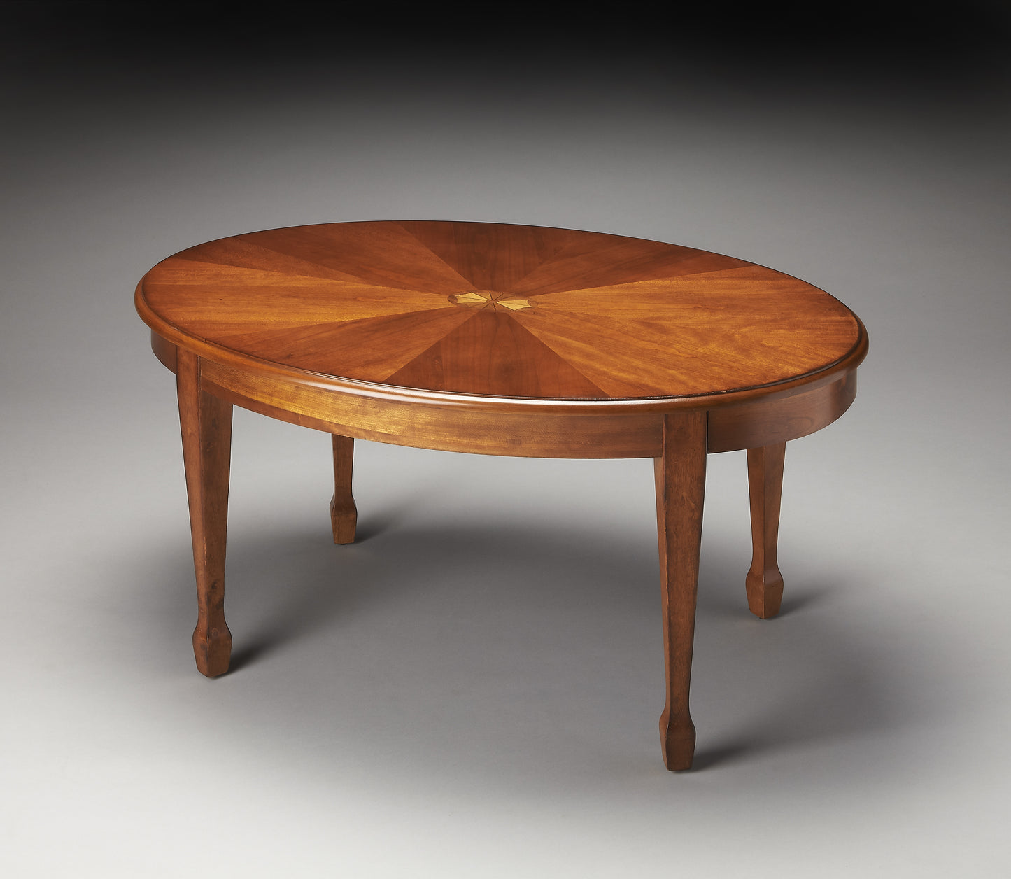 Butler Specialty Company Clayton 38 in. W Oval Wood Coffee Table with Veneer Linen-Fold Inlay, Medium Brown