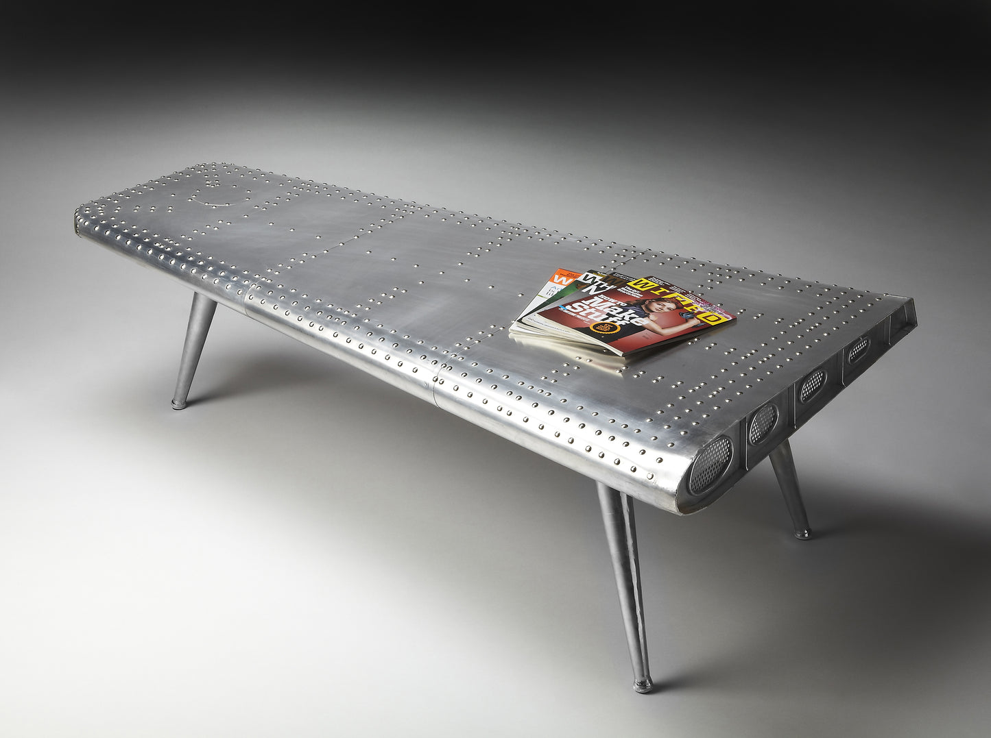 Butler Specialty Company Midway 59.5 in. W Triangular Novelty Metal and Wood Aviator Themed Coffee Table, Silver