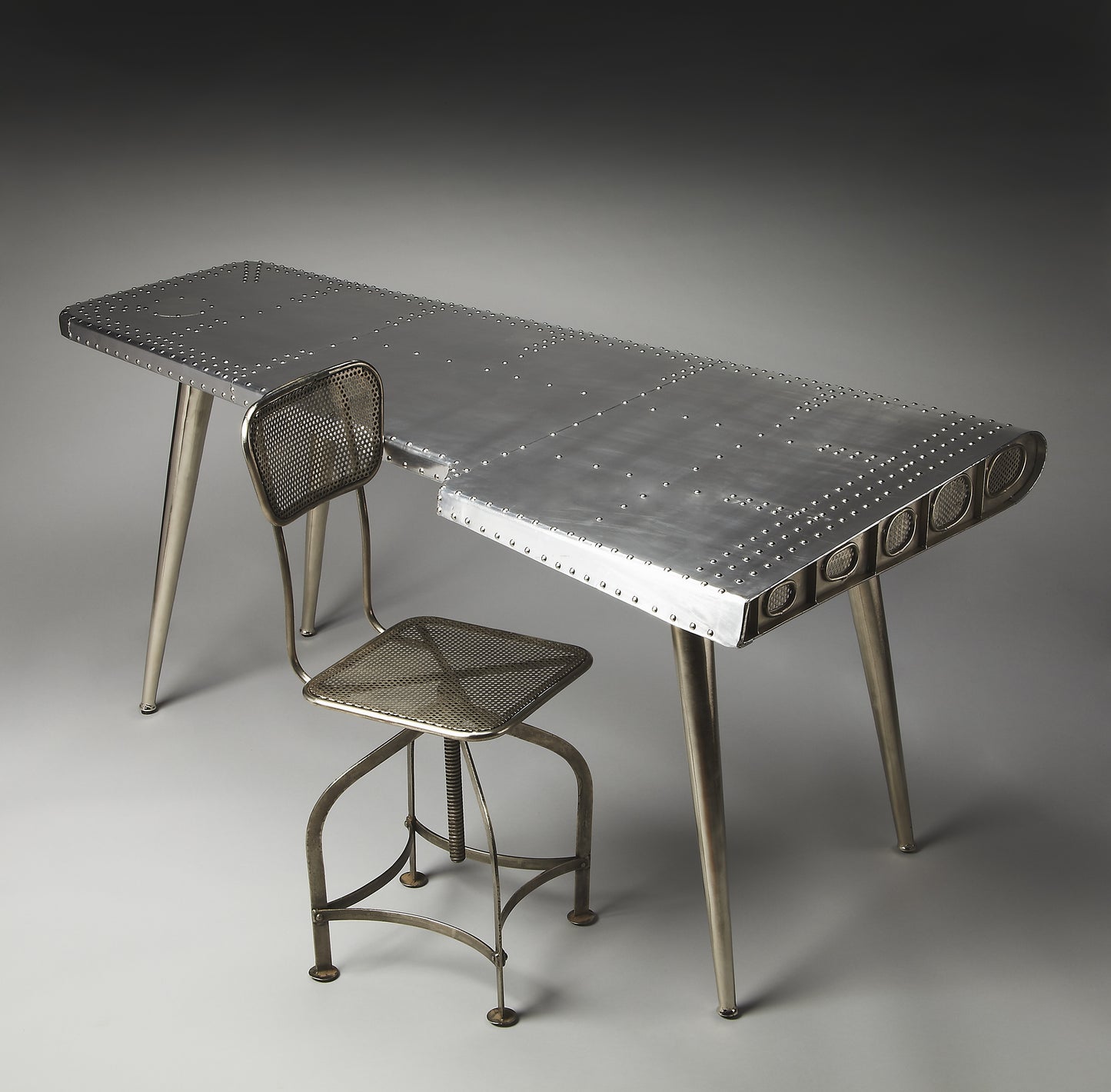 Butler Specialty Company Midway 65.5 in. W Triangular Metal and Wood Aviator Themed Desk, Silver