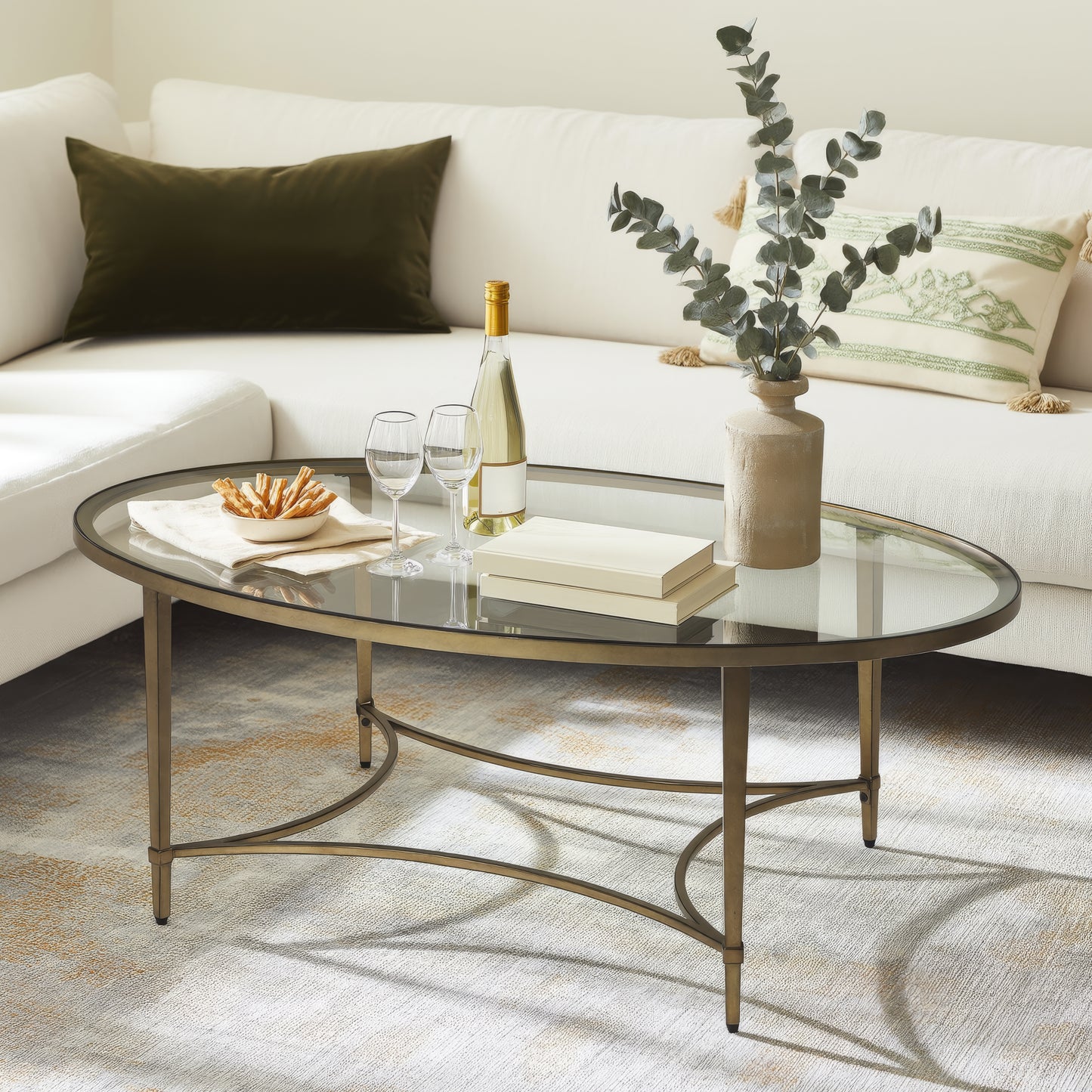 Butler Specialty Company Monica 50 in. W Oval Glass and Metal Coffee Table, Gold