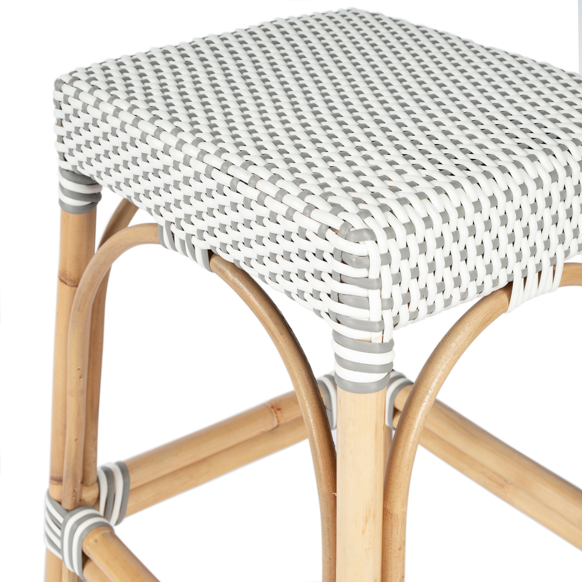 Butler Specialty Company Robias 24.5 in. Seat Height Rectangular Rattan Backless Counter Stool with Footrest, Gray and White Dot
