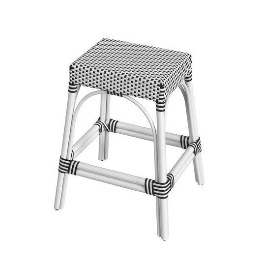 Butler Specialty Company Robias 24.5 in. Seat Height Rectangular Rattan Backless Counter Stool with Footrest, White and Black Dot