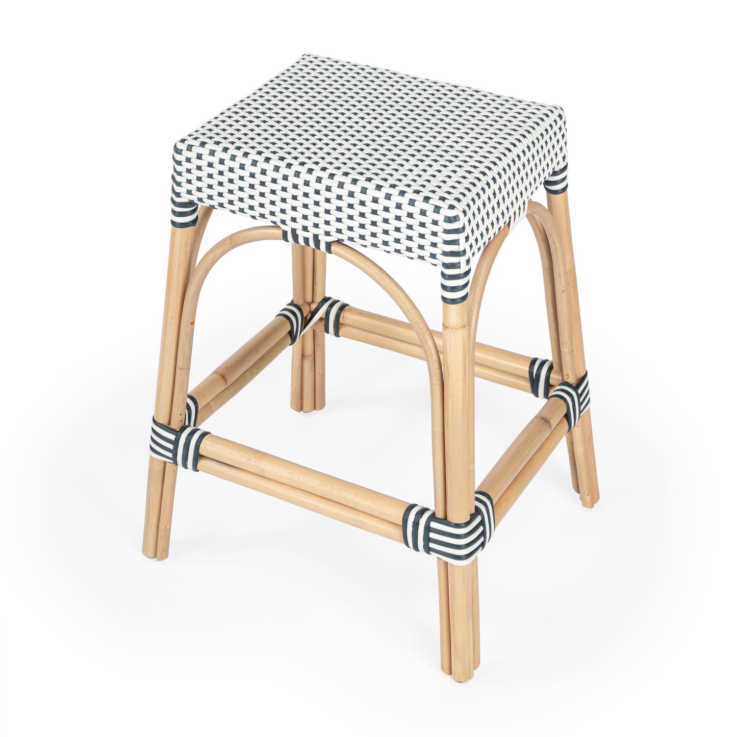 Butler Specialty Company Robias 24.5 in. Seat Height Rectangular Rattan Backless Counter Stool with Footrest, White and Navy Dot