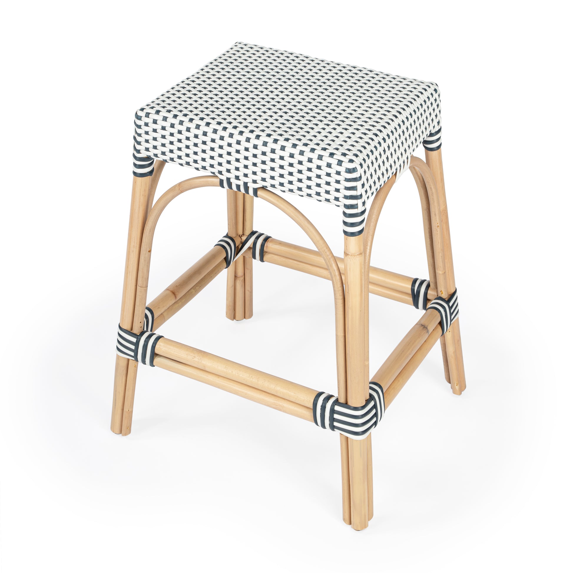 Butler Specialty Company Robias 24.5 in. Seat Height Rectangular Rattan Backless Counter Stool with Footrest, White and Navy Dot