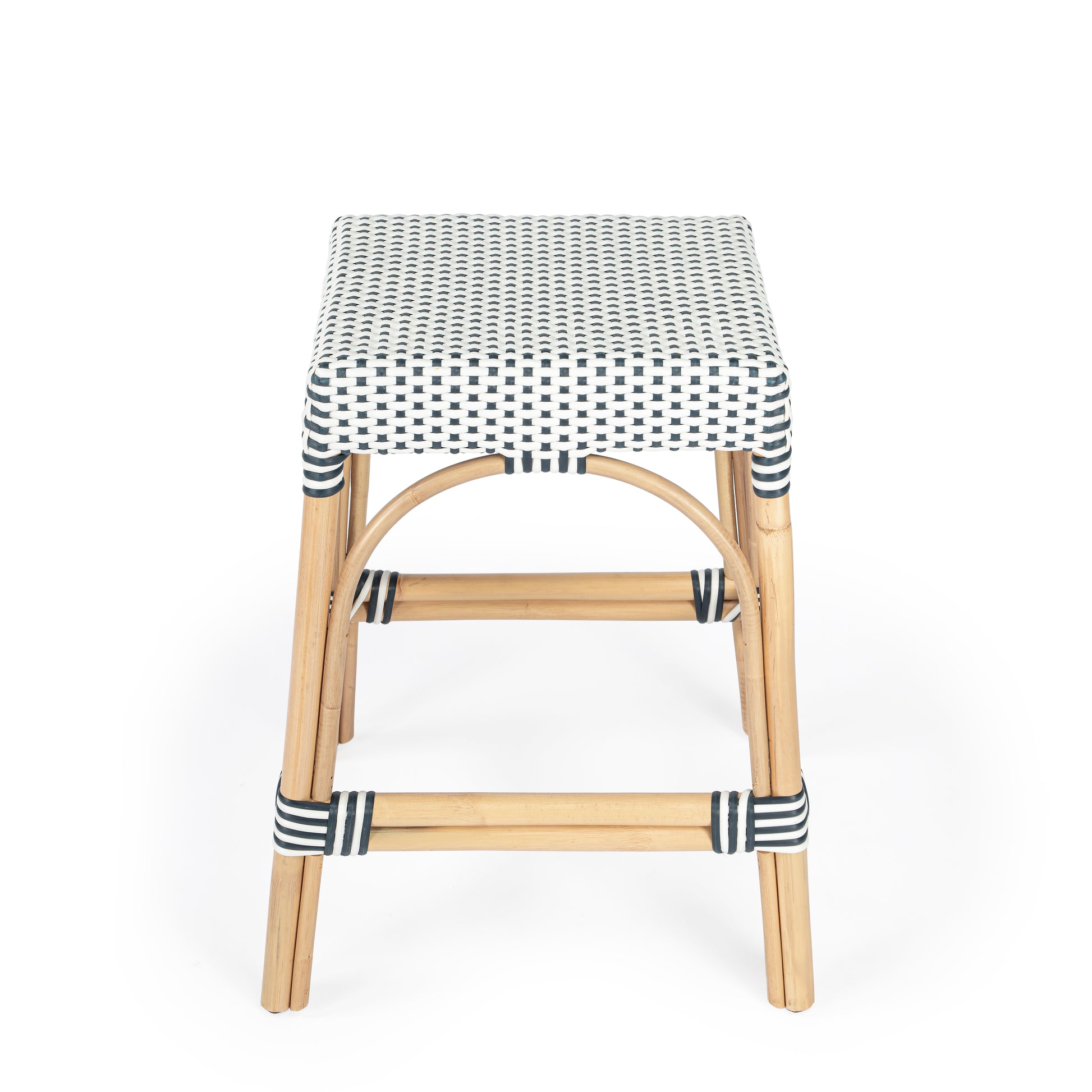 Butler Specialty Company Robias 24.5 in. Seat Height Rectangular Rattan Backless Counter Stool with Footrest, White and Navy Dot