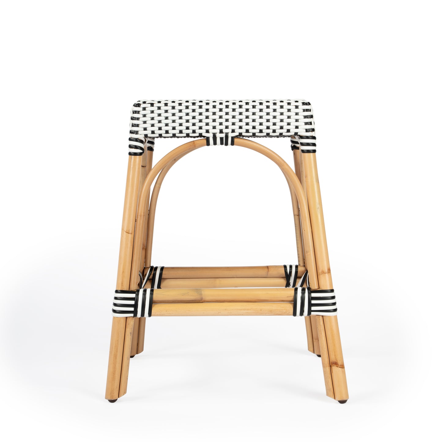 Butler Specialty Company Robias 24.5 in. Seat Height Rectangular Rattan Backless Counter Stool with Footrest, White and Black Dot