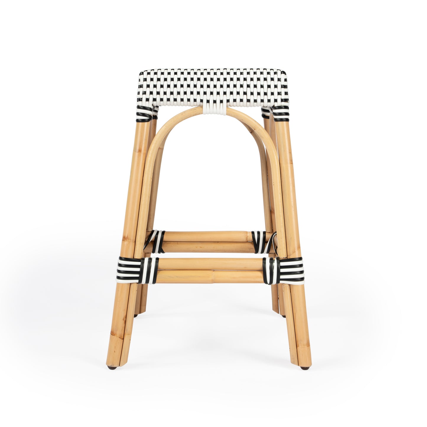 Butler Specialty Company Robias 24.5 in. Seat Height Rectangular Rattan Backless Counter Stool with Footrest, White and Black Dot