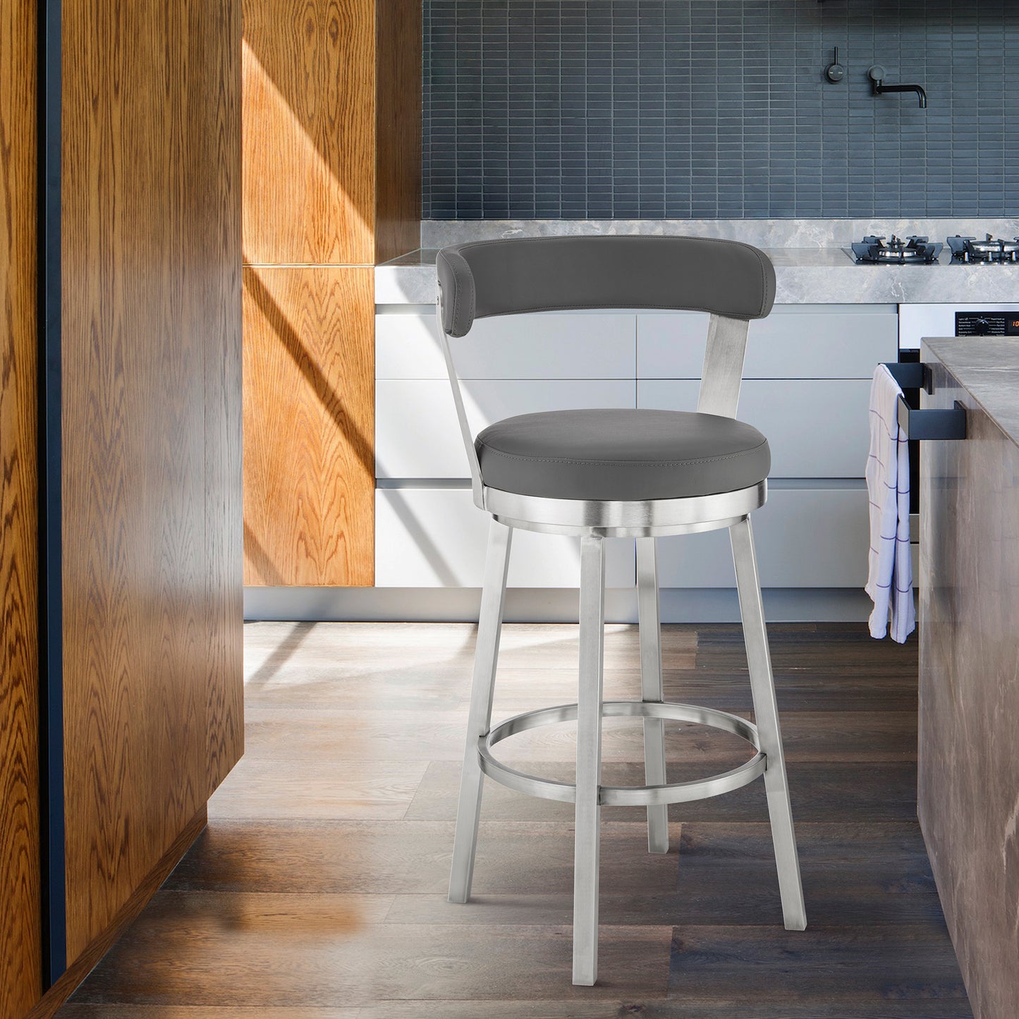Bryant Bar Height and Counter Height Swivel Bar Stool in Brushed Stainless Steel and Black Finish