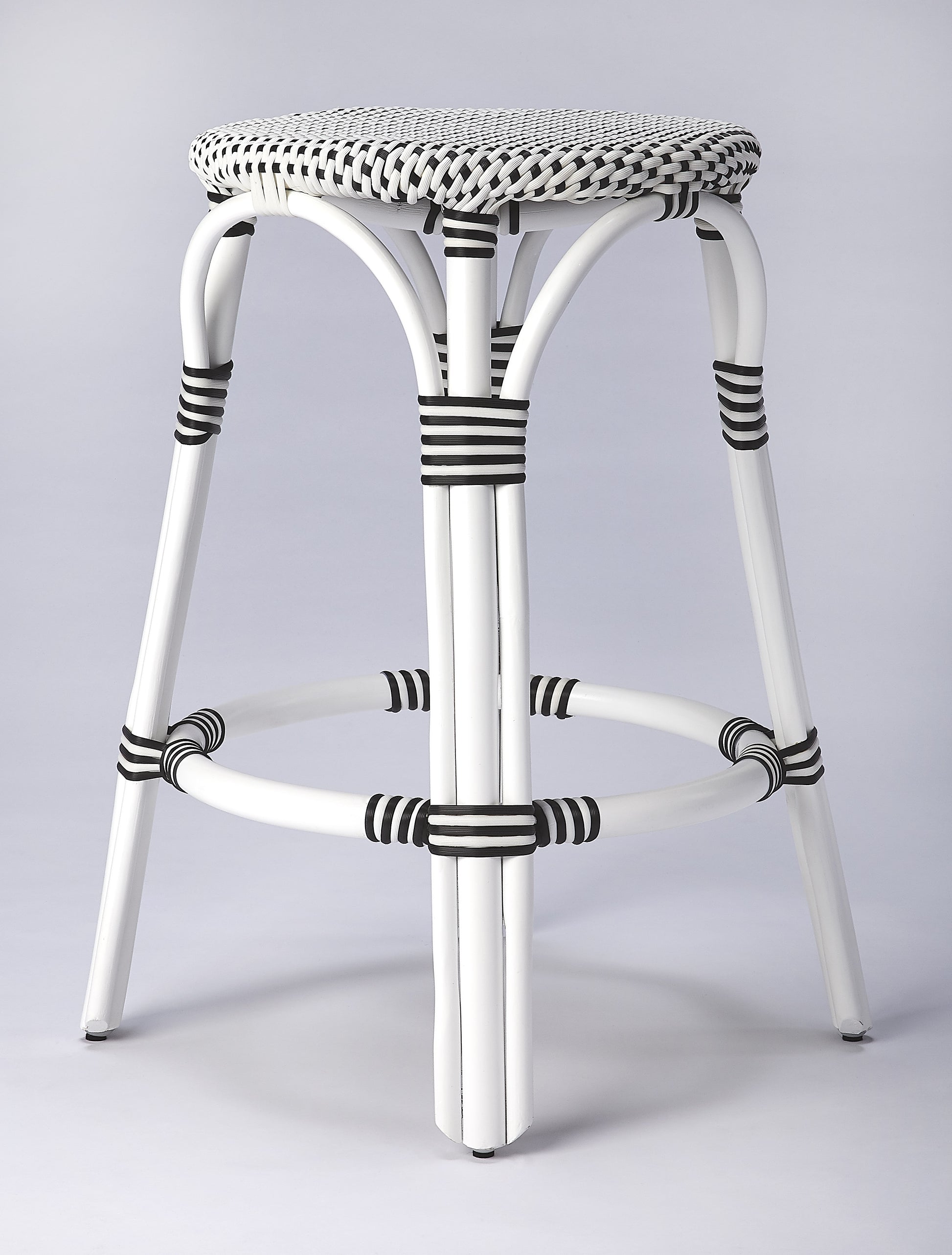 Butler Specialty Company Tobias 24 in. Seat Height Round Rattan Backless Counter Stool, White and Black Dot