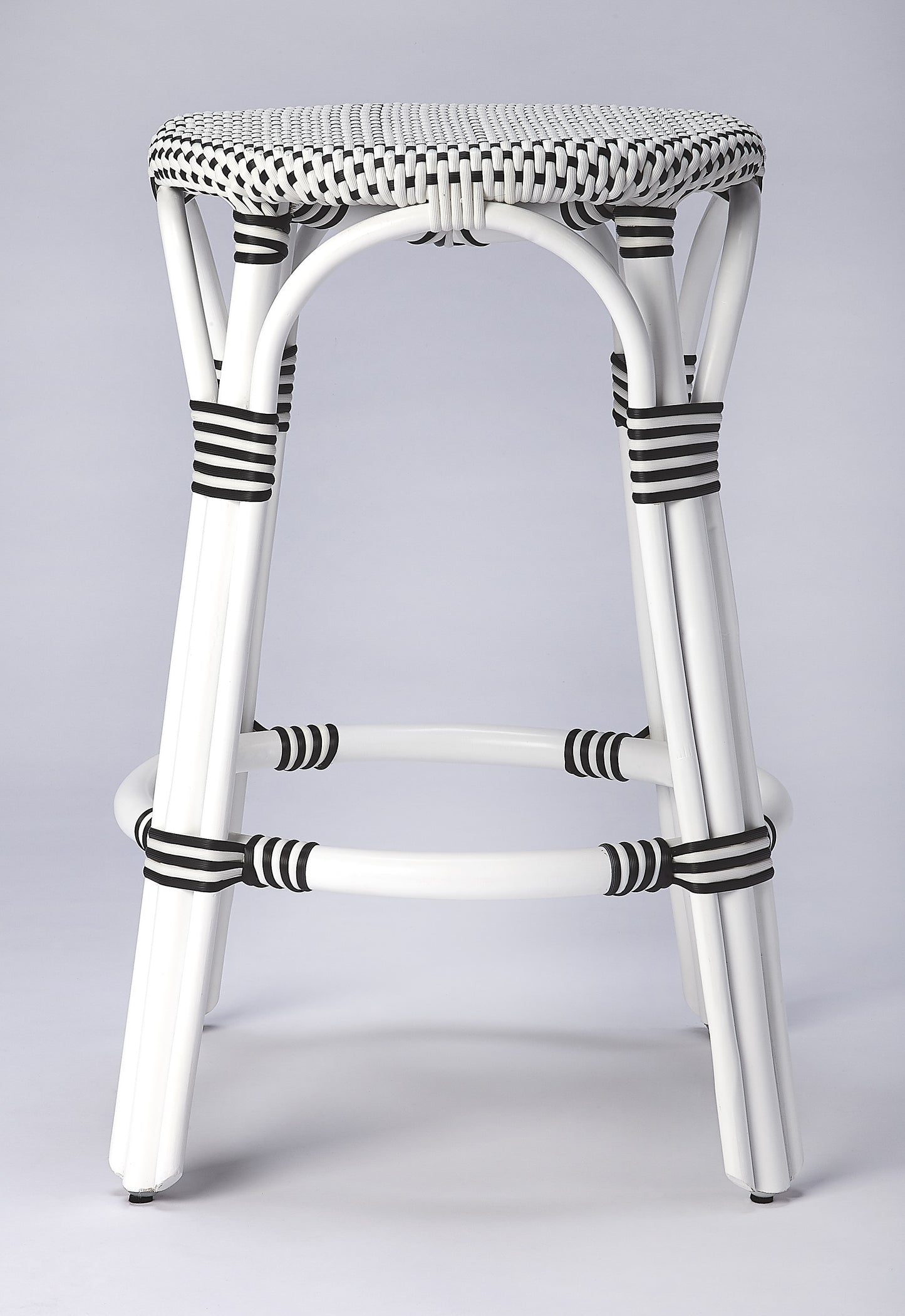 Butler Specialty Company Tobias 24 in. Seat Height Round Rattan Backless Counter Stool, White and Black Dot