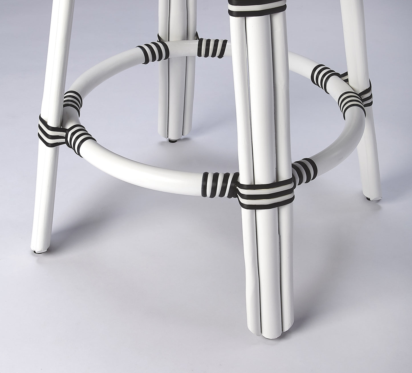 Butler Specialty Company Tobias 24 in. Seat Height Round Rattan Backless Counter Stool, White and Black Dot