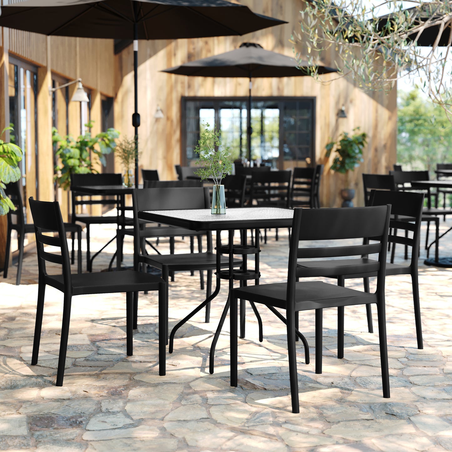 Bridgeport Indoor-Outdoor Stacking Patio Chair with Slatted Backrest, Commercial All-Weather Resin Chair in Black Black