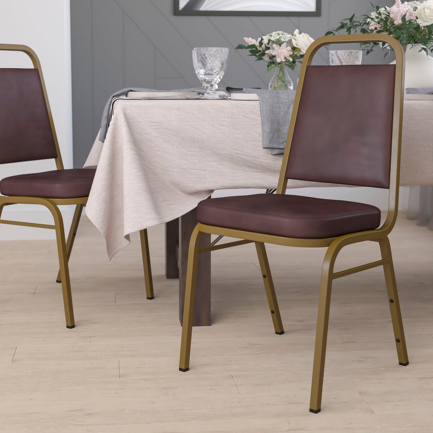 HERCULES Series Trapezoidal Back Stacking Banquet Chair in Brown Vinyl - Gold Frame Brown Vinyl/Gold Frame