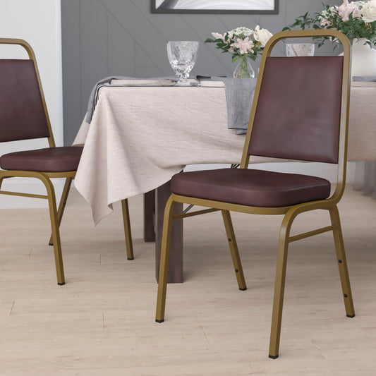 HERCULES Series Trapezoidal Back Stacking Banquet Chair in Brown Vinyl - Gold Frame Brown Vinyl/Gold Frame