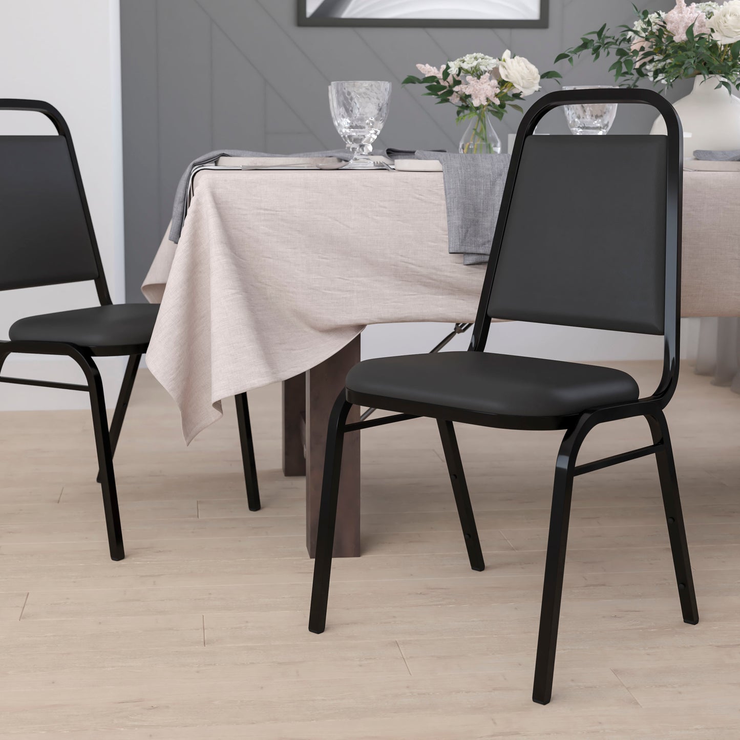 HERCULES Series Trapezoidal Back Stacking Banquet Chair in Black Vinyl - Black Frame Black Vinyl/Black Frame FD-BHF-2-GG