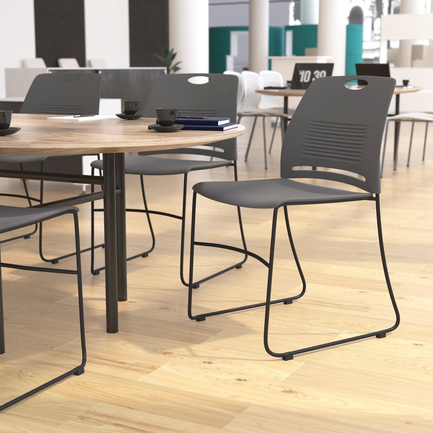HERCULES Series Commercial Grade 660 lb. Capacity Gray Plastic Stack Chair with Black Powder Coated Sled Base Frame and Integrated Carrying Handle Gray