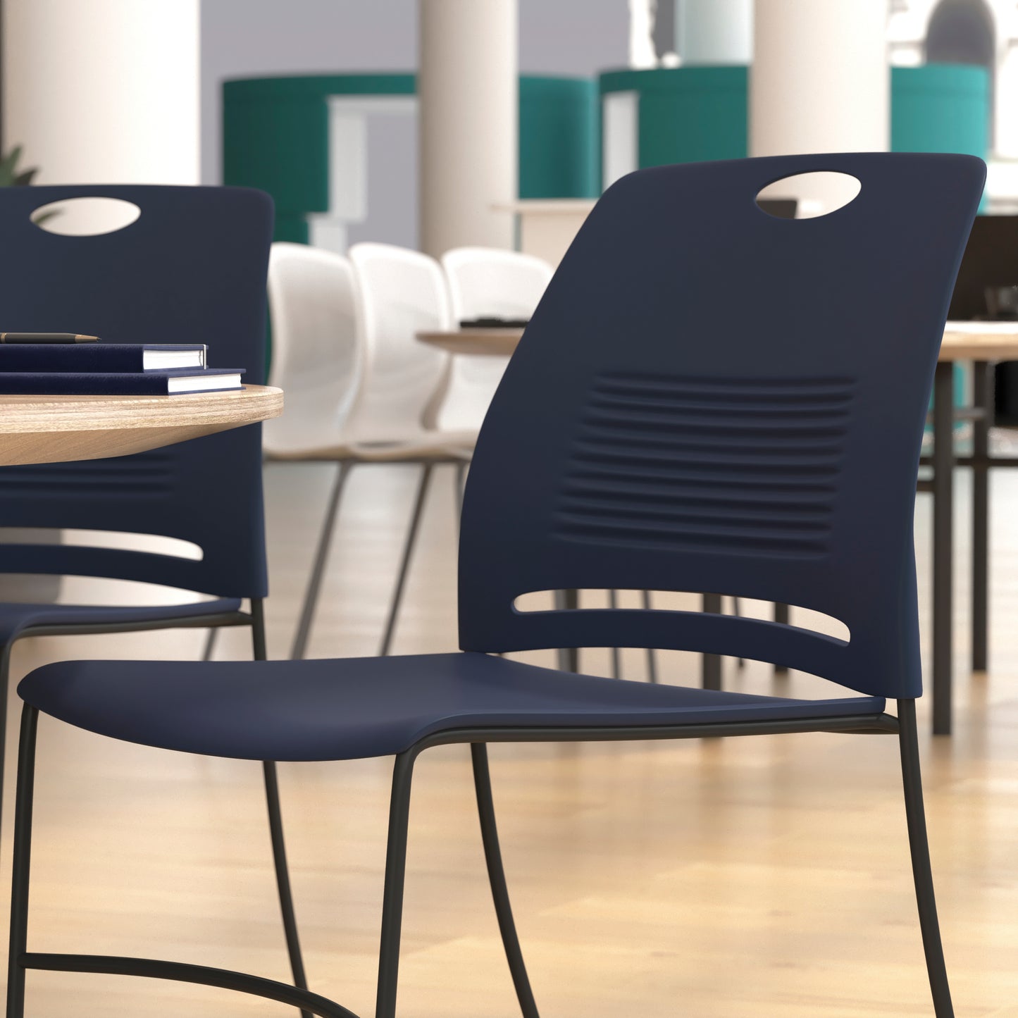 HERCULES Series Commercial Grade 660 lb. Capacity Navy Plastic Stack Chair with Black Powder Coated Sled Base Frame and Integrated Carrying Handle Navy