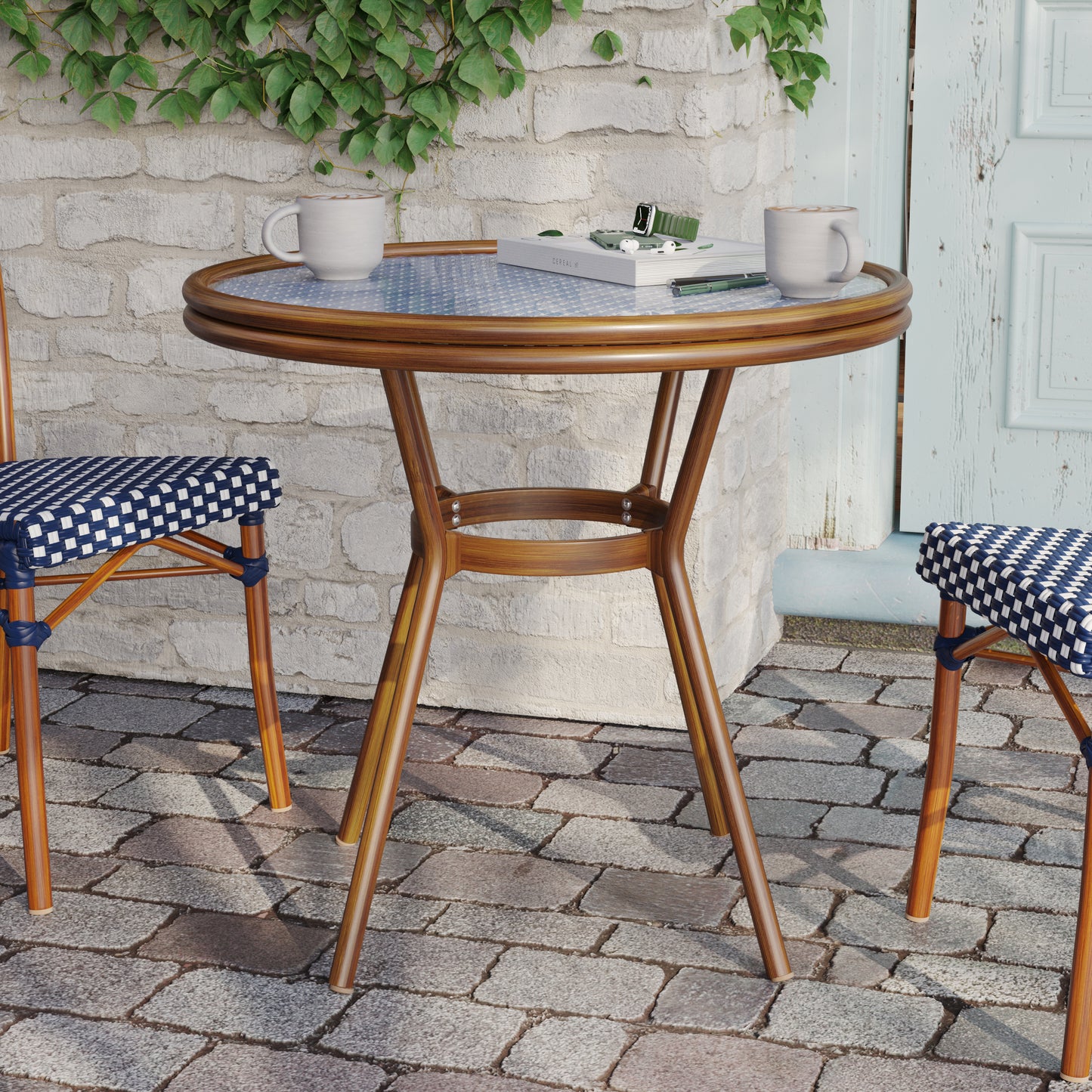 Lourdes Indoor/Outdoor Commercial Bistro 31.5" Table, Navy and White PE Rattan, Glass Top, Bamboo Print Aluminum Frame in Natural Navy & White Rattan/Natural Frame