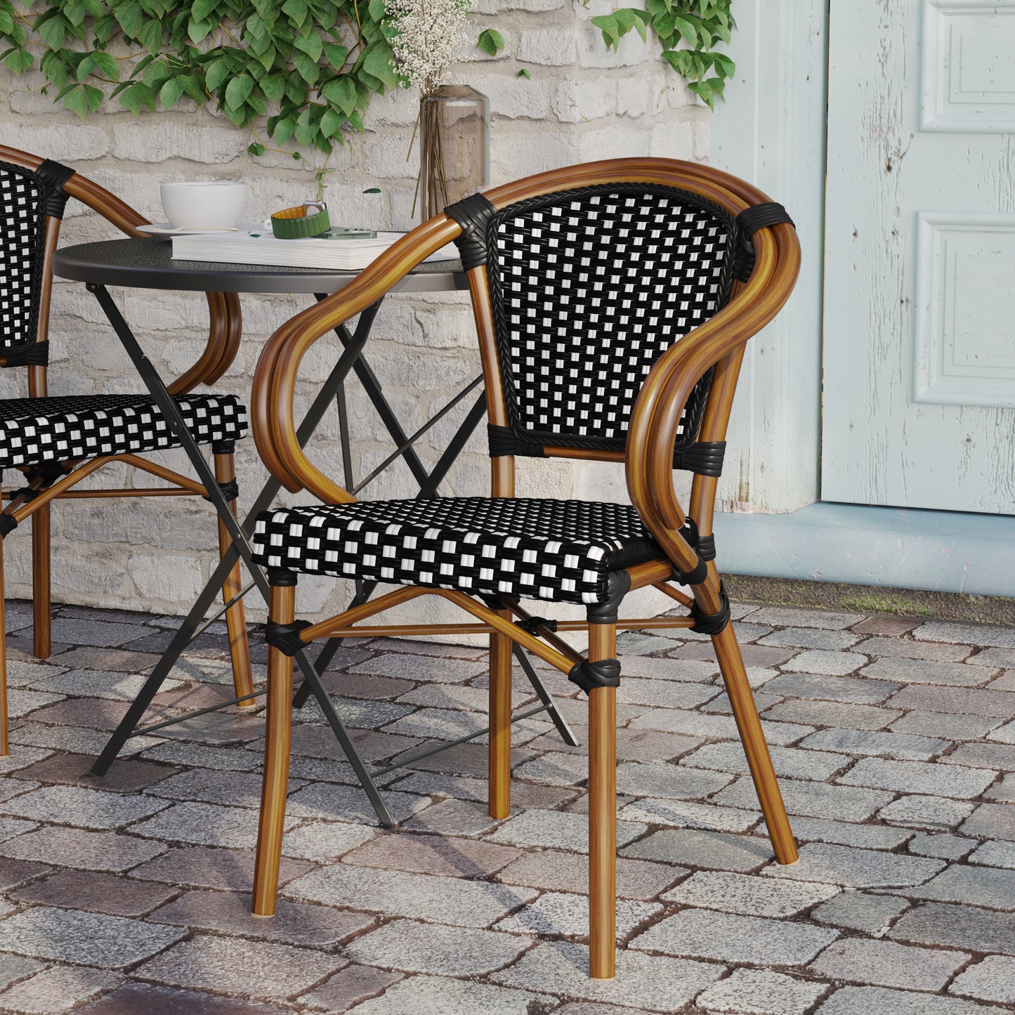 Bordeaux Indoor/Outdoor Commercial Bistro Stacking Chair with Arms, Black and White PE Rattan and Bamboo Print Aluminum Frame in Natural Black & White/Natural Frame